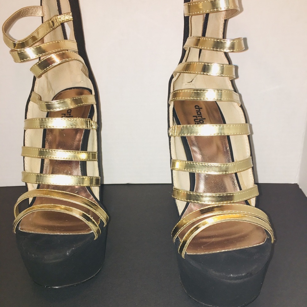 Black platform heels with gold straps